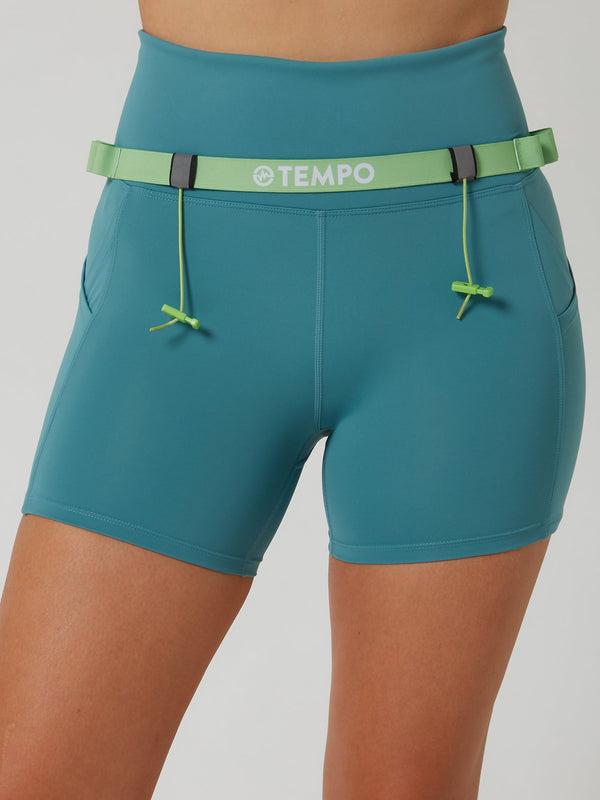 PACE Race Belt in Moss Green holding a race bib and energy gels
