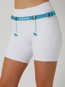 PACE Race Belt in Tide Blue holding a race bib and energy gels