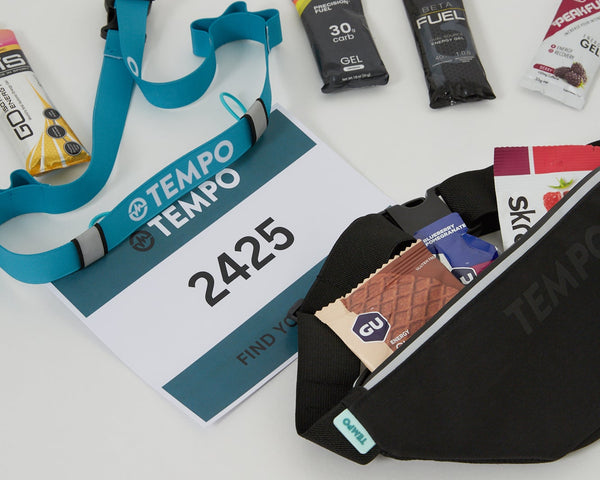A runner wearing a TEMPO running belt
